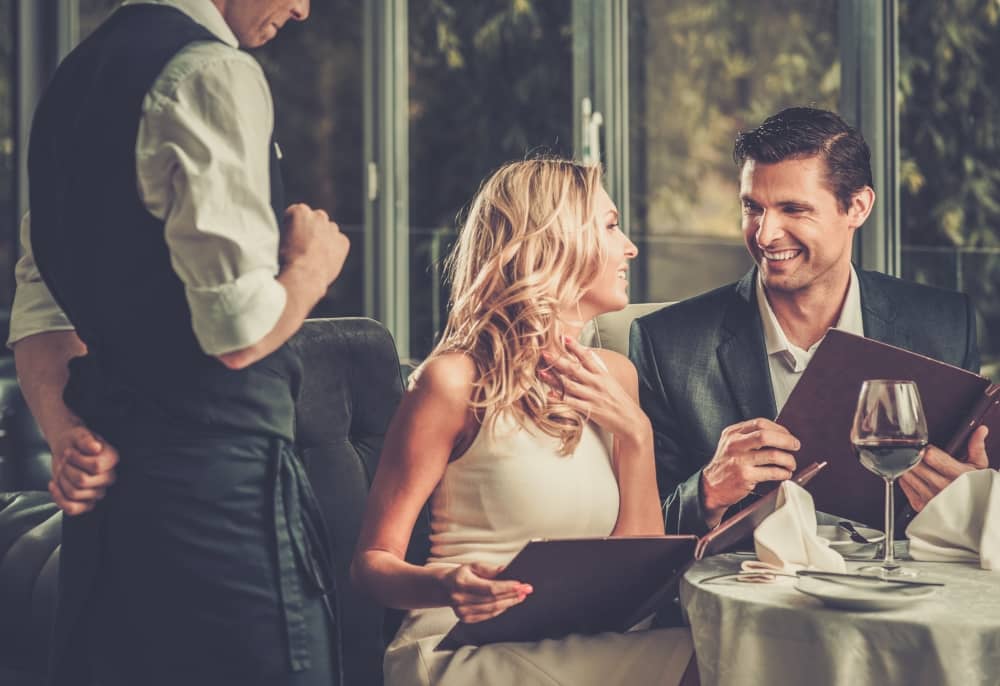 Man and woman enjoying their dinner date.