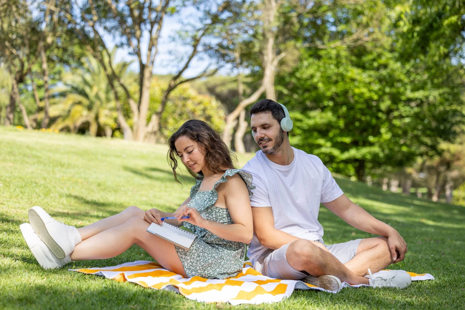 man and woman having picnic