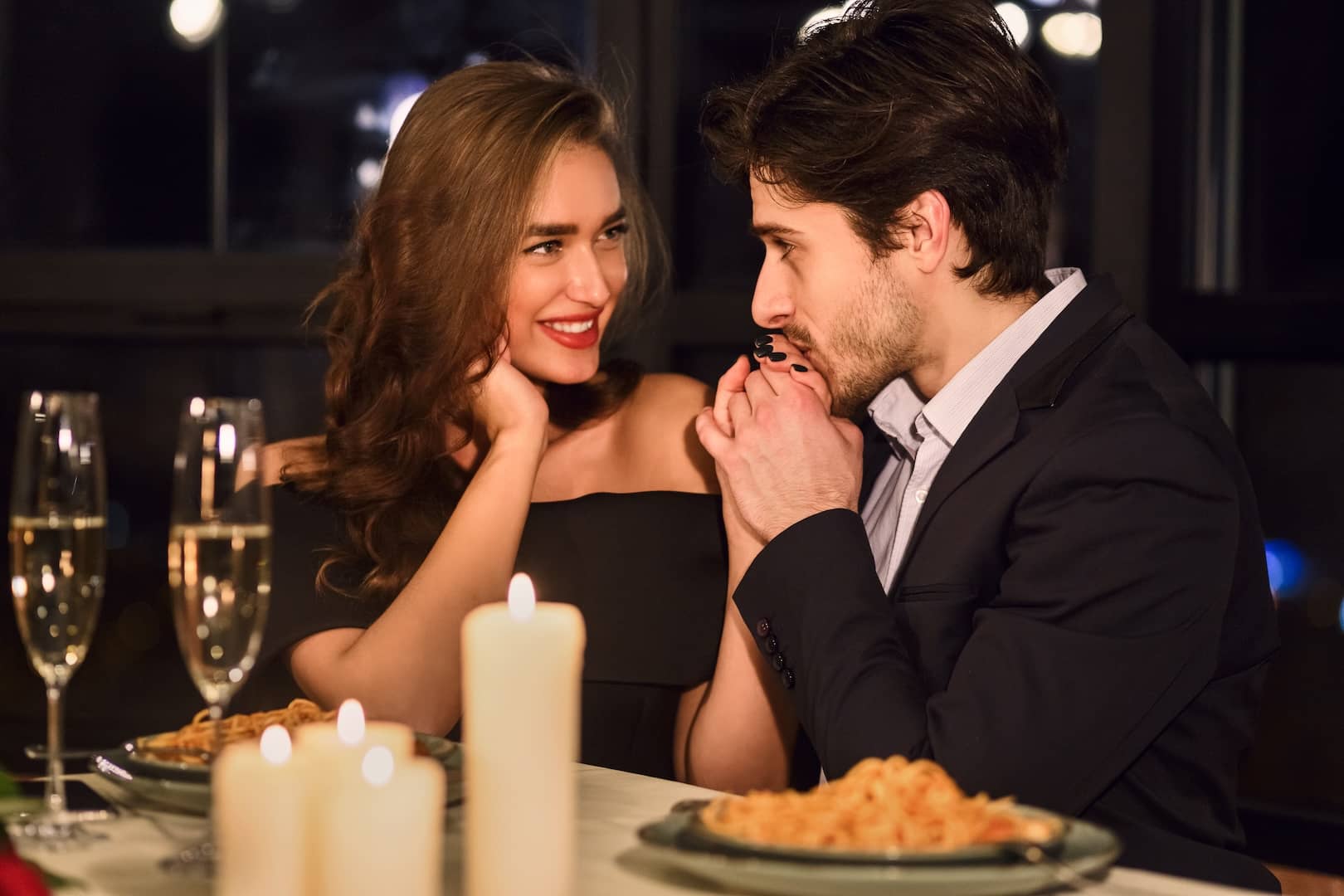 man and woman having a romantic dinner