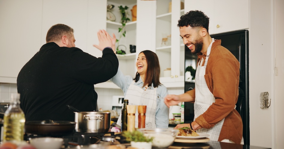 couple in the kitchen cooking with a chef on a date